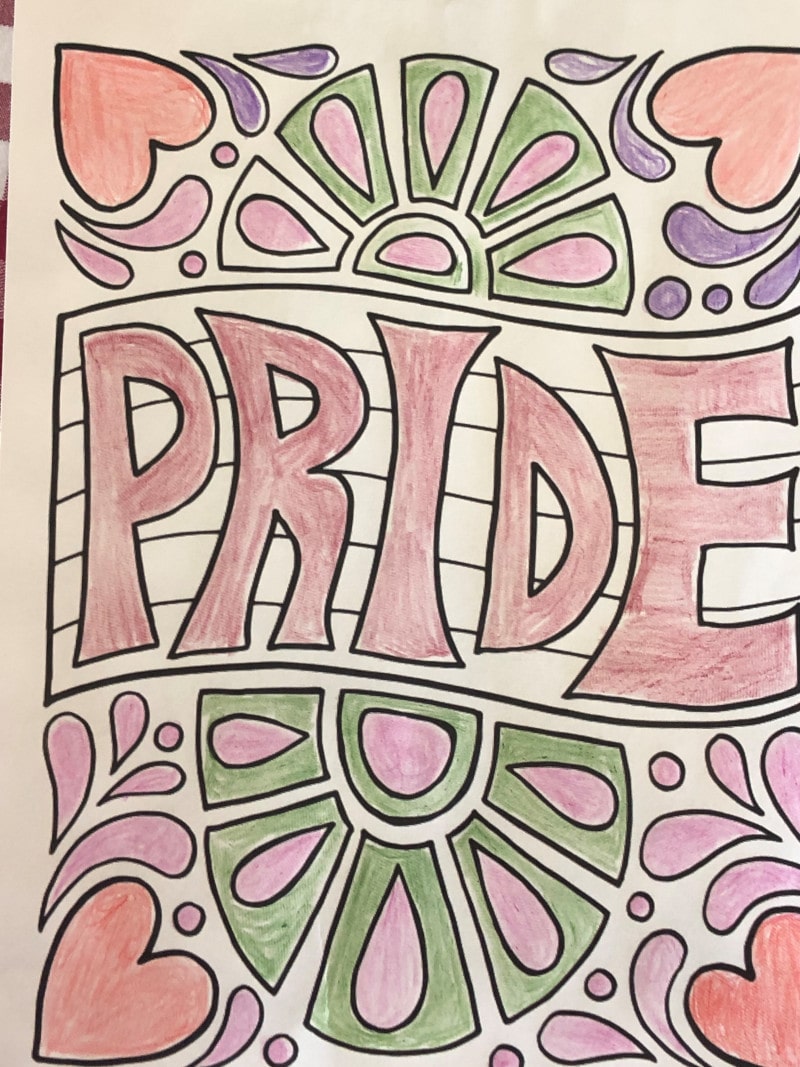 Decorating the lounge with rainbow bunting, balloons and laying the tables for lunch